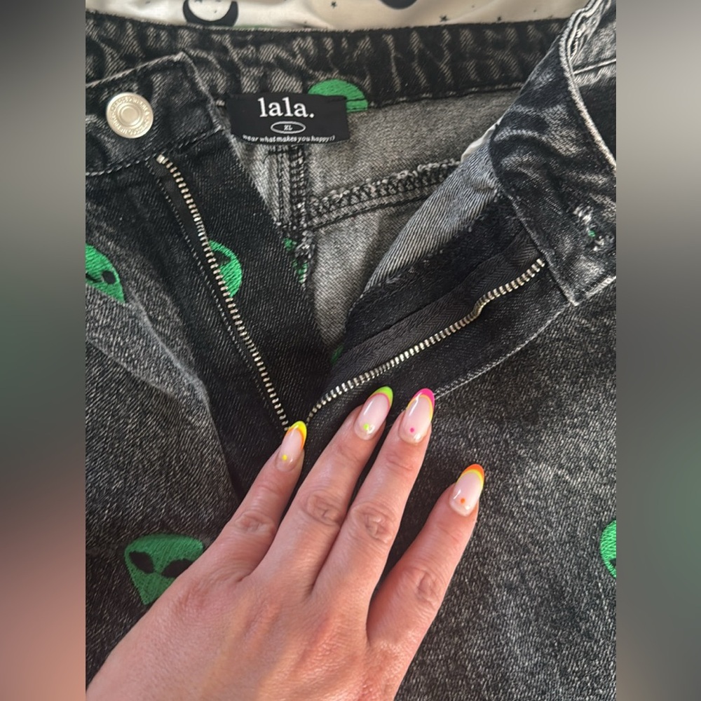 Dressed in LALA Black Flare Jeans with Green Alien Print - Picture 2 of 4